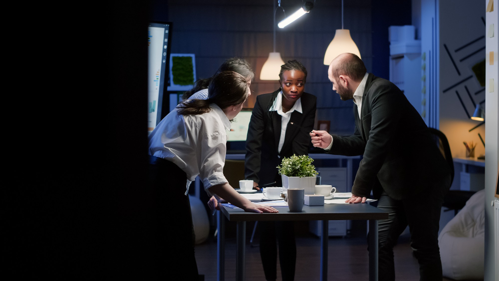 various-entrepreneurs-discussing-paperwork-management-table-standing-conferences